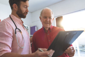 doctor with elderly male patient