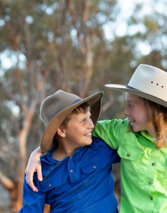 Young boy and girl in Akubras